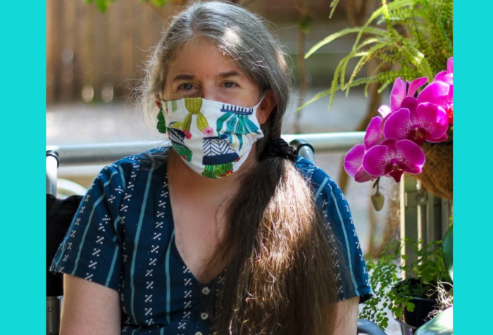 Graphic with a teal background featuring a photo of Ingrid, a middle-aged White woman with a long gray/brown ponytail who is wearing a bright blue dress and a colorful cloth face-mask. She's sitting in her wheelchair outdoors, next to a fuschia orchid. Photo credit: Christopher Egusa.