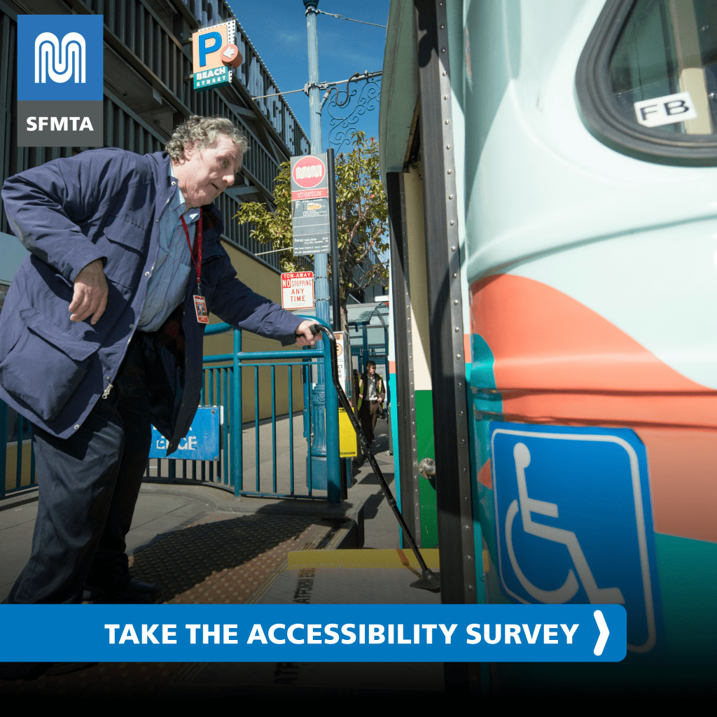 photo of an older white adult who uses a can standing at a platform for a MUNI light rail train