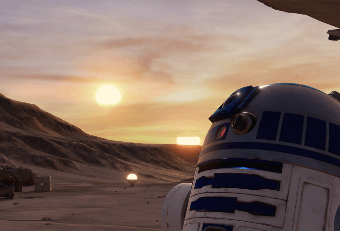 Illustration from a Lucasfilm Ltd ILMxLAB virtual reality experience, "Trials on Tatooine." The image shows in the character R2-D2 from the Star Wars universe in the lower-right side of the image in the foreground. R2-D2 is a droid with white and blue markings including a camera and several other tools and sensors on the upper part of its body. In the background is the Tatooine, a fictional desert planet from the Star Wars universe. The background shows several rocky formations, a pale sky with scattered clouds and two suns low to the horizon.